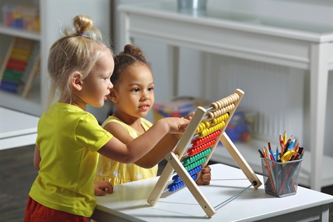 Two preschool girls playing